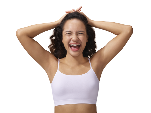 Woman smiling with her hands behind her head