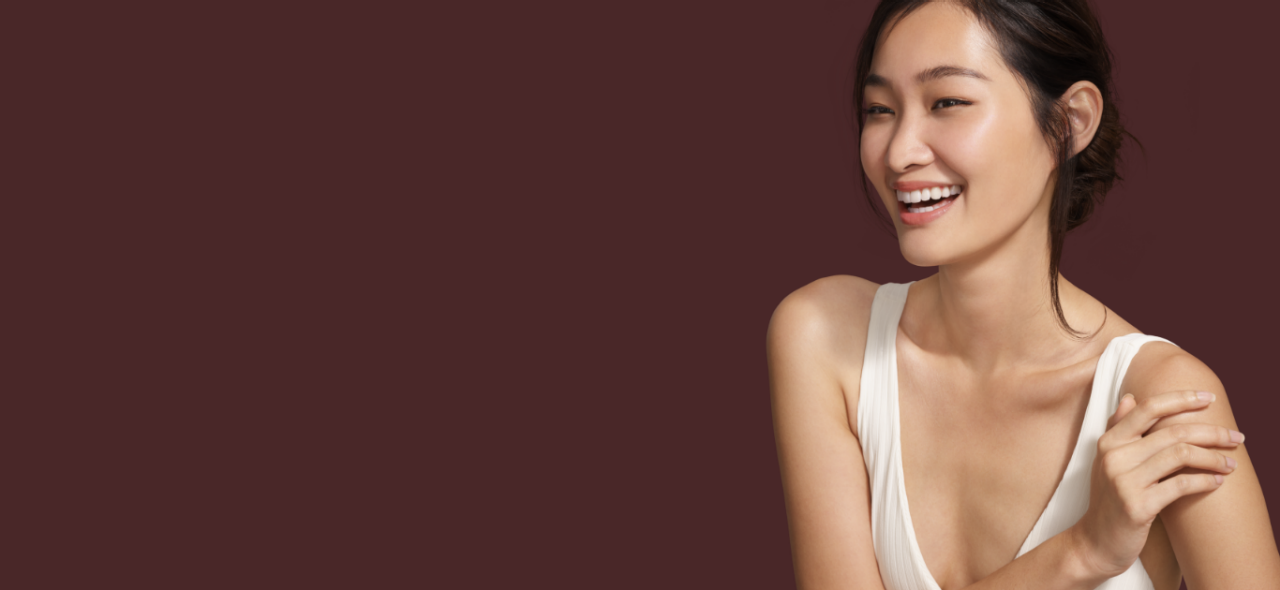 Asian woman smiling with clear skin